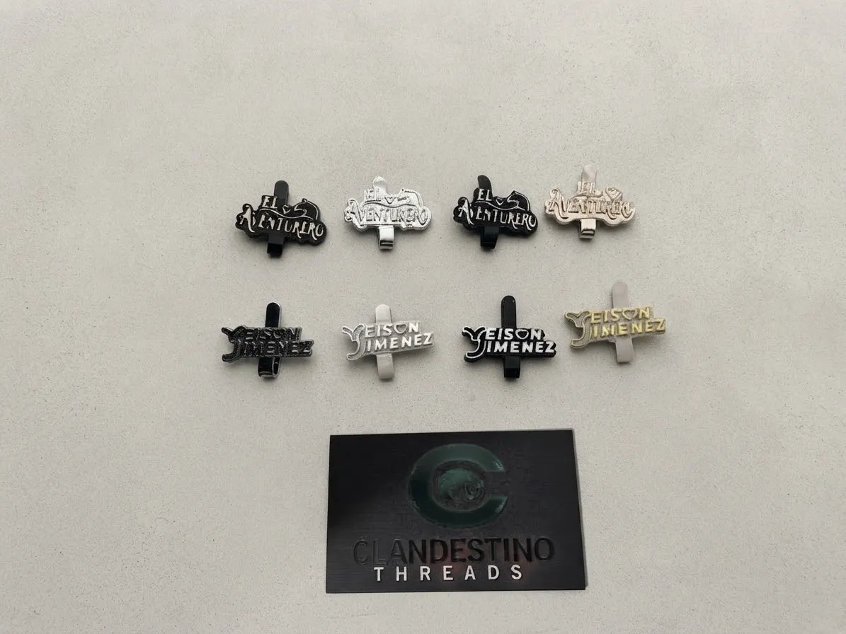 Colección de Pines Metálicos – Clandestino Threads x Yeison Jiménez