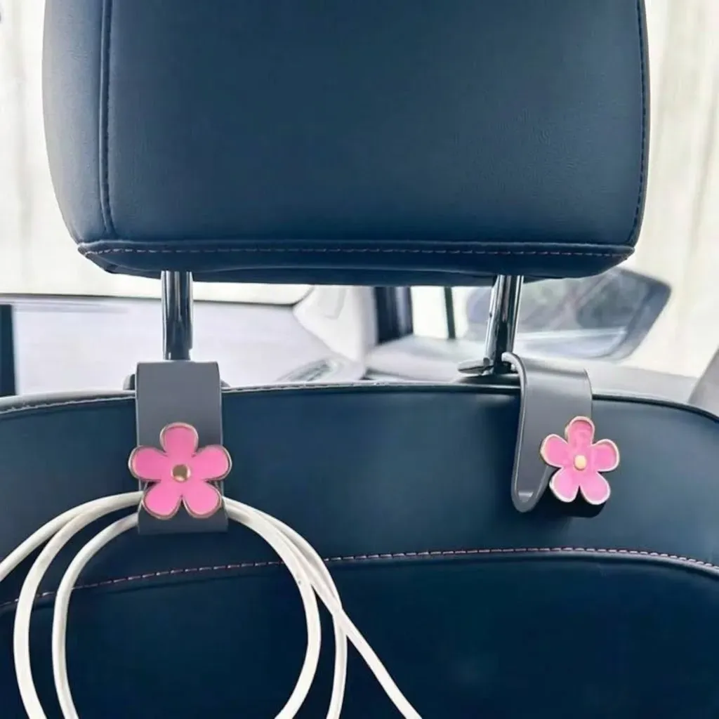 Gancho de cabecera de vehiculo con flor rosa clara